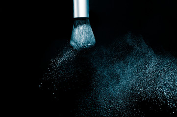 Deep ocean powder color splash and silver brush for makeup artist or beauty blogger in black...