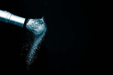 Deep ocean powder color splash and silver brush for makeup artist or beauty blogger in black...