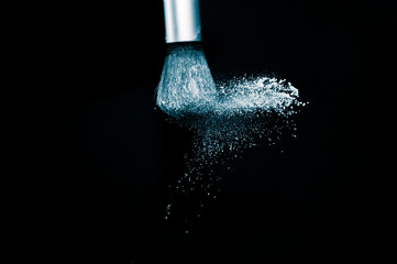 Deep ocean powder color splash and silver brush for makeup artist or beauty blogger in black...