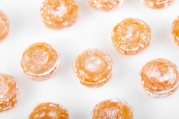 Colored round candy in powdered sugar. Bright candy.