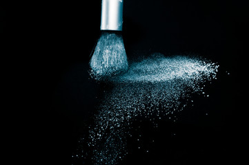 Deep ocean powder color splash and silver brush for makeup artist or beauty blogger in black...