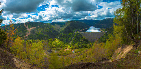 Naklejka premium Hydropower lake dam panoramic aerial view landscape