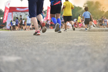 A family running with healthy lifestyle sport running in ChiangMai marathon at Royal park.,a lot of copy space.