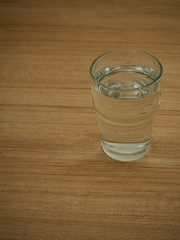 Glass water on wooden table