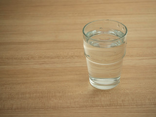 Glass water on wooden table
