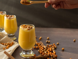 boza or bosa, a traditional Turkish drink roasted chickpeas and cinnamon on the brown table