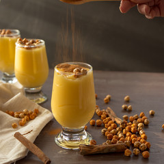 boza or bosa, a traditional Turkish drink roasted chickpeas and cinnamon on the brown table