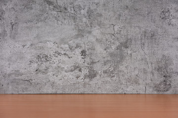 Loft concrete wall with wooden table