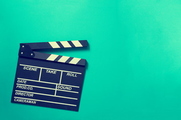 movie clapper on green background ; film, cinema and vedio photography concept