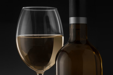 White wine bottle and glass on the black background