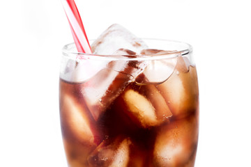 Cola in glass with straw and ice cubes isolated on white background. Soda with bubbles isolated on white. Refreshing non-alcoholic drink