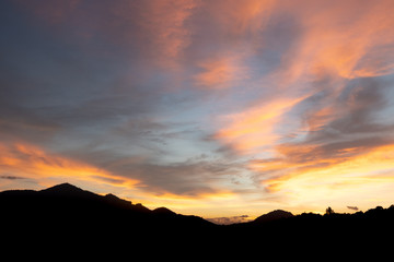 Beautiful sunset with mountains covered with orange horizon in Mae Sot, Thailand.