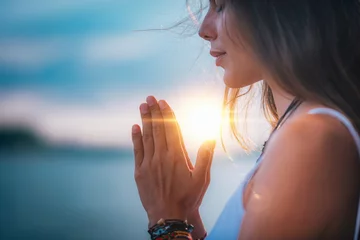 Fotobehang Meditating. Close Up Female Hands Prayer © Microgen