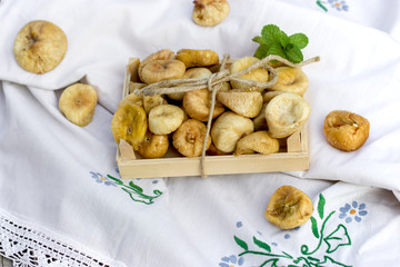 Delicacy, sweet and nutritious fruit - dried organic figs on table