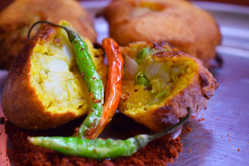 Indian roadside spicy fast food with fried green chilies 