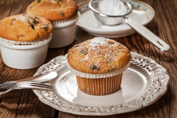 Tasty muffins on wooden boards