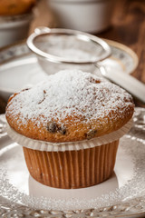 Tasty muffins on wooden boards