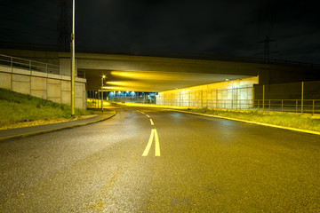 Deserted urban underpass at night
