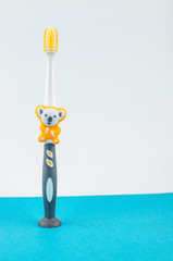 Toothbrushes on blue background. Copy space for text