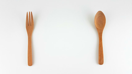 fork and spoon wood top view and blank space on white background