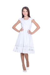 Portrait of beautiful girl in white dress posing on white background