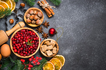 Christmas food baking background top view on black background.