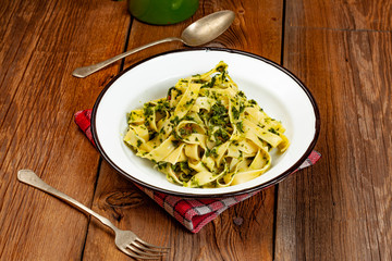 Spaghetti with spinach and bacon.
