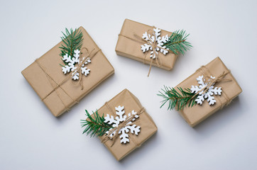 Fototapeta na wymiar Christmas Gifts with Fir Branches on White Background, Winter Holidays Concept