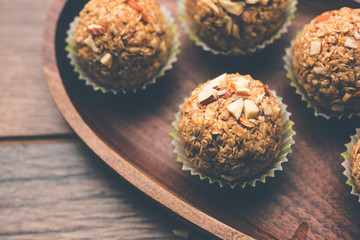 Oats laddu or Ladoo also known as Protein Energy balls. served in a plate or bowl. selective focus