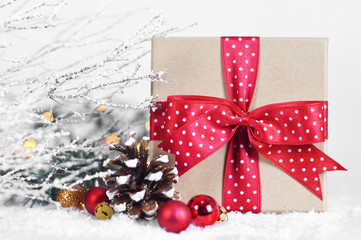 Fototapeta na wymiar Close up of Christmas gift box with red ribbon