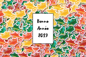Bonne AnnÃ©e 2019 card (Happy New Year in french) with colored holly leaves as a background
