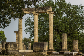 antique marble colonnade ruins of ancient temple of destroyed city in park outdoor environment, sightseeing and excursion tourist concept