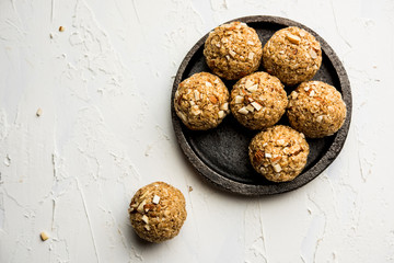 Oats laddu or Ladoo also known as Protein Energy balls. served in a plate or bowl. selective focus
