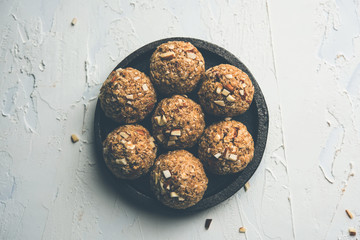 Oats laddu or Ladoo also known as Protein Energy balls. served in a plate or bowl. selective focus