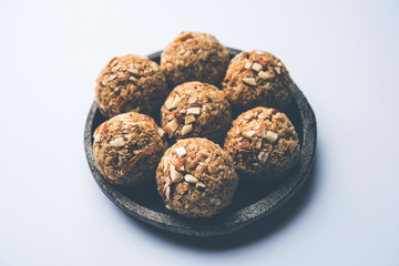 Oats laddu or Ladoo also known as Protein Energy balls. served in a plate or bowl. selective focus
