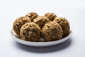 Oats laddu or Ladoo also known as Protein Energy balls. served in a plate or bowl. selective focus