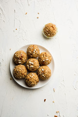 Oats laddu or Ladoo also known as Protein Energy balls. served in a plate or bowl. selective focus