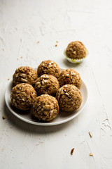 Oats laddu or Ladoo also known as Protein Energy balls. served in a plate or bowl. selective focus