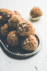 Oats laddu or Ladoo also known as Protein Energy balls. served in a plate or bowl. selective focus