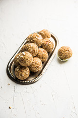 Oats laddu or Ladoo also known as Protein Energy balls. served in a plate or bowl. selective focus
