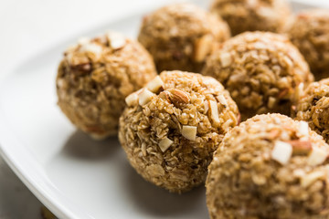 Oats laddu or Ladoo also known as Protein Energy balls. served in a plate or bowl. selective focus