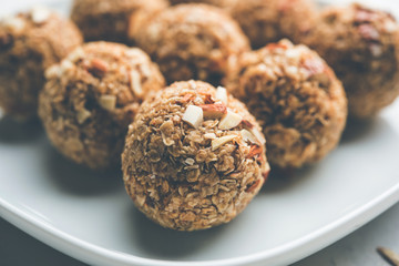 Oats laddu or Ladoo also known as Protein Energy balls. served in a plate or bowl. selective focus