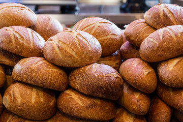 Fresh sourdough bread stacked in a bakery ready to sell and eat
