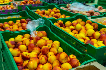 Peaches Packed boxes lying on the counter of the supermarket.