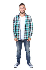 Young man in shirt and jeans isolated on white background