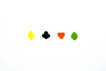 multicolored playing card symbols against white background