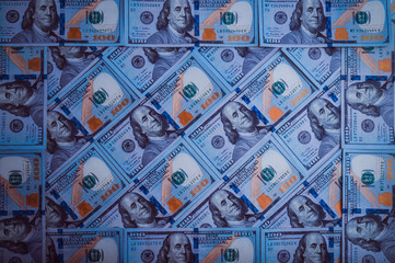 The background of a hundred dollar bills. Blue design.