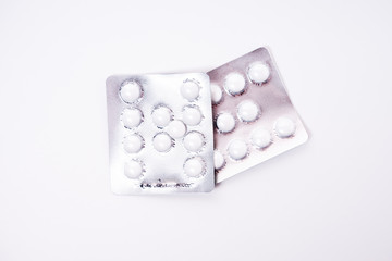Pills on white background
