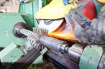 The disk mill on the sharpening machine is processed by a grinding stone. Sharpening cutting tools with grinding stone metalworking equipment. Sparks from work fly in different directions.