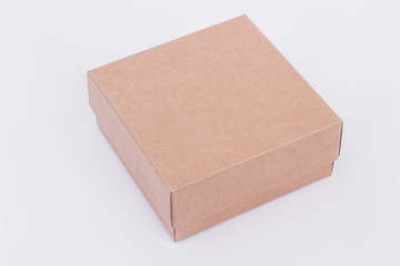 Brown cardboard gift box. Plain carton present box isolated. Gifts wrapping concept.